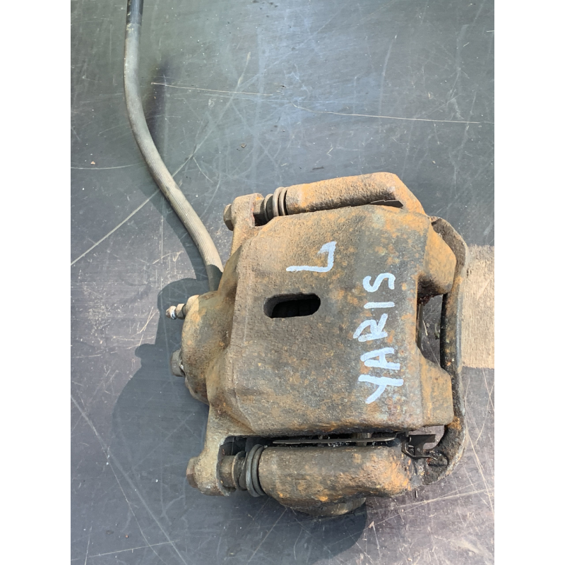 Суппорт гальмівний передній лівий Toyota Yaris 4775052020